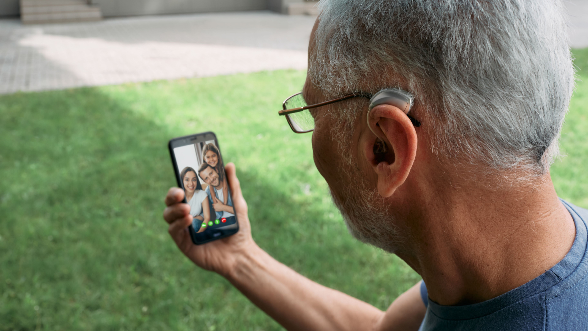 older man looking at mobile phone 1920x1080 (1)