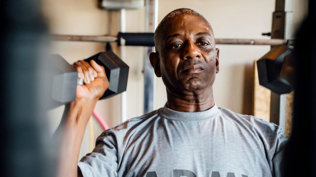 veteran with hearing loss lifting weights